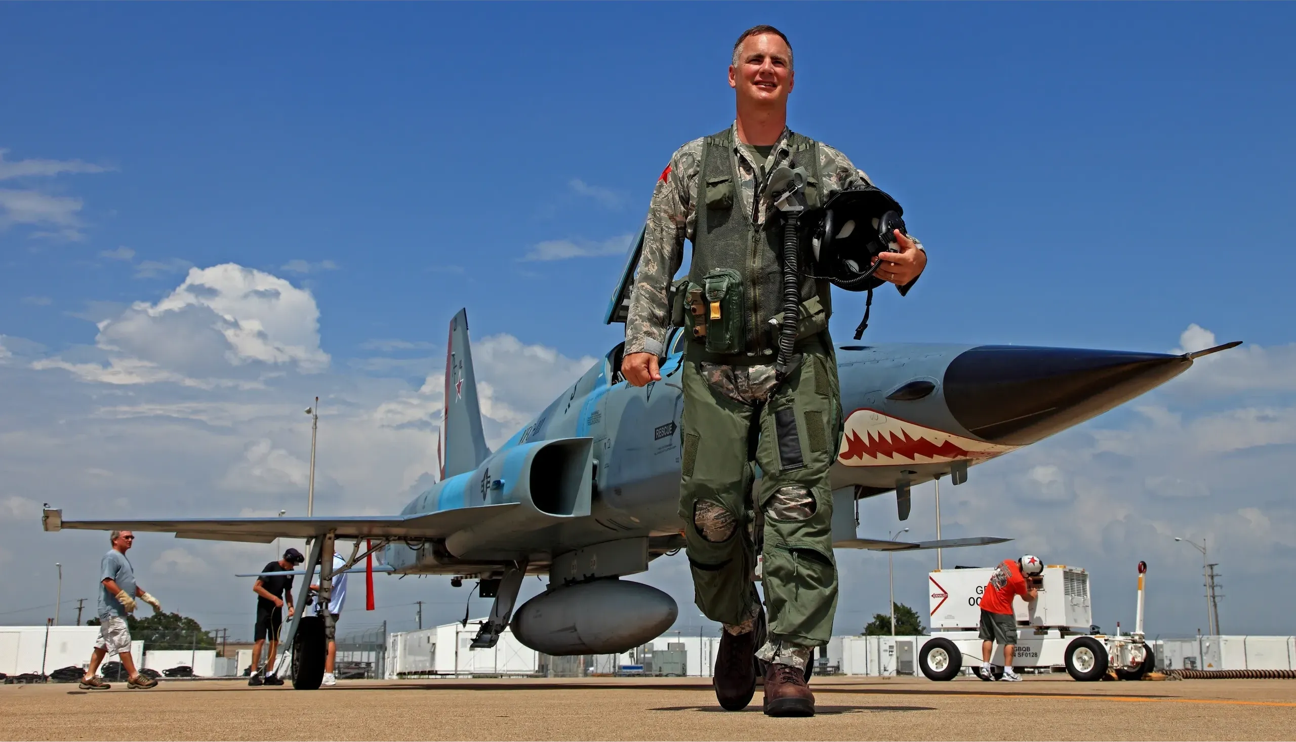 Captain John 'Bag' Hefti in Navy flight suit and uniform